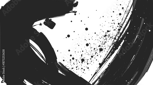 Dynamic black ink brush stroke with splatters on a white background, creating an abstract and expressive artistic texture.