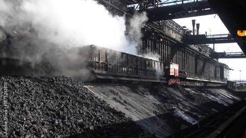 Coke oven plant in operation producing hard but reactive metallurgical coke for blast furnace use.