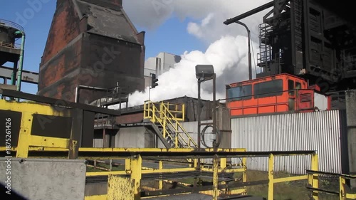 Coke oven plant in operation producing hard but reactive metallurgical coke for blast furnace use.