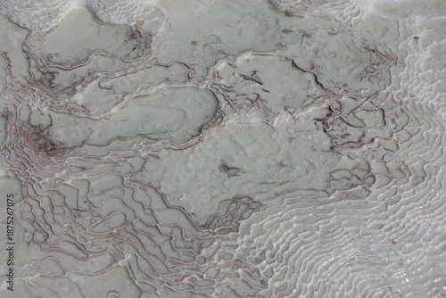 Carbonate mineral patterns left by the flowing of thermal spring mineral rich water at Pamukkale