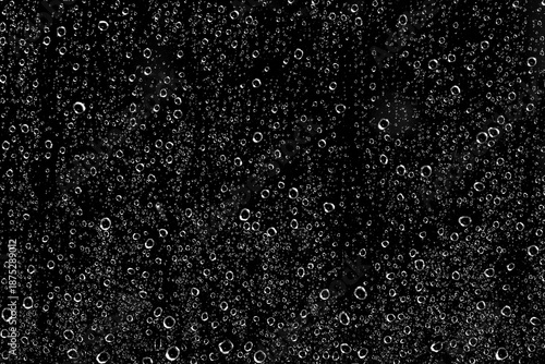 Fotografi Thousands of water droplets (H2O) on a window pane with a black night background on a rainy day