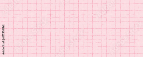 Textured sheet of pink checkered paper with a stipple effect. Cute pastel background, irregular geometric pattern.