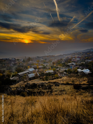 A beautiful sunset in Armenia, showing a stunning landscape of mountains, fields, forests and a shining sky. High quality photo