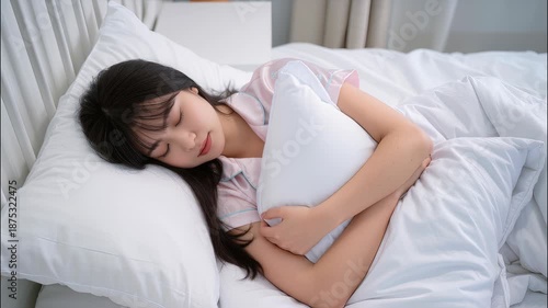 Young woman sleeping in bed, comfort mattress and pillow