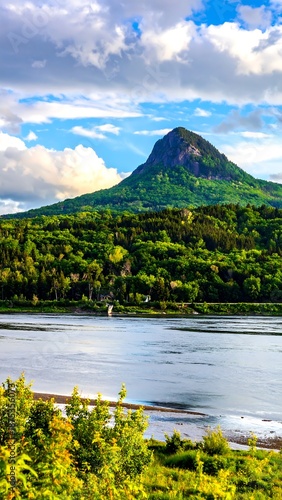 Picturesque Mountain Landscape with Lake and Lush Greenery.