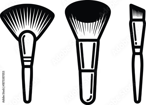 Three different makeup brushes