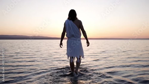 Silhouette of Jesus Christ walking on water at sunrise, religious spiritual concept of faith, miracle, and divinity