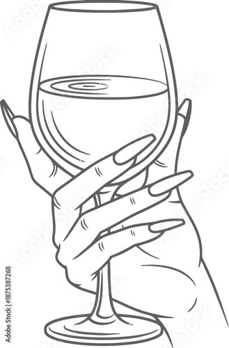 Hand holding a wine glass with water