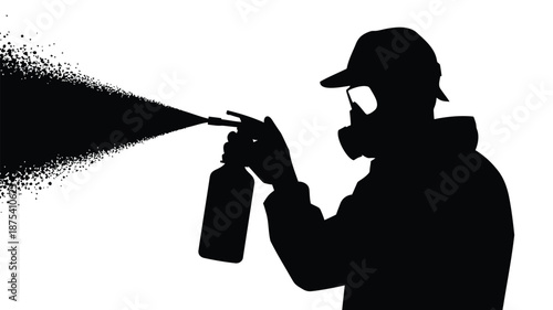 Man in silhouette spraying substance from can
