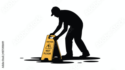 Man placing wet floor caution sign on slippery surface