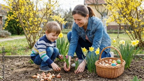 Woman and child planting flower bulbs for spring gardening. Family activity outdoors for Easter holiday. Natural lifestyle and education
