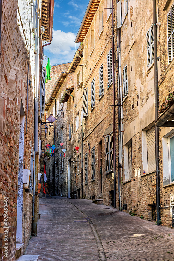 Fototapeta premium The historic streets of Urbino, a medieval town in Marche, Italy, with charming stone buildings and steep, winding staircases. Urbino, Marche, Italy
