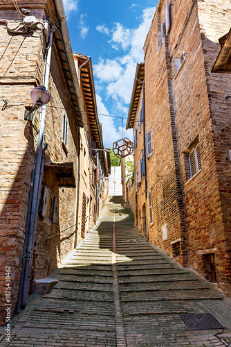The historic streets of Urbino, a medieval town in Marche, Italy, with charming stone buildings and steep, winding staircases. Urbino, Marche, Italy