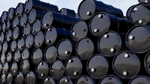 Stacked black metal containers in a warehouse, angled view with metallic sheen, against a sky