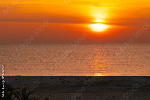 Beautiful sunrise over Hua Hin beach in Prachuap Khiri Khan, Thailand, featuring golden sunlight, calm sea, and a peaceful coastal atmosphere, ideal for travel, tourism, and nature photography.
