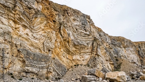 Wallpaper Mural Limestone quarry walls with visible geological layers and formations. Industrial mining site for construction materials and geology study Torontodigital.ca