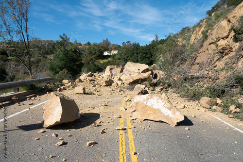 Fotografie Rock slide boulders blocking Santa Susana Pass Road in the San Fernando Valley area  of Los Angeles California