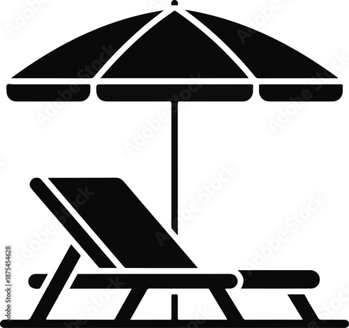 Silhouette of a beach umbrella and deck chair lounger
