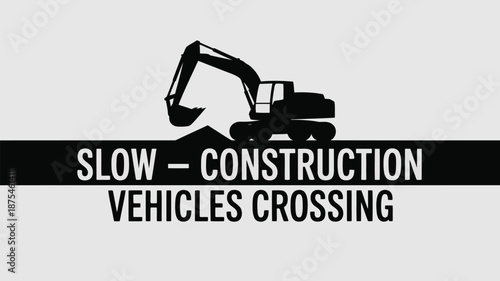 Road sign warning of slow construction vehicles crossing
