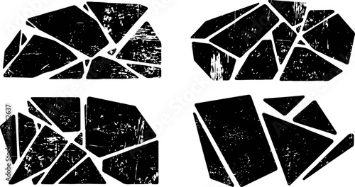 Four grunge cracked stone or rock shapes with distressed textures and irregular fracture patterns