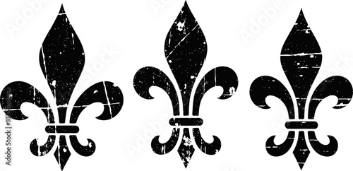 Set of three distressed black fleur de lis symbols with vintage grunge texture