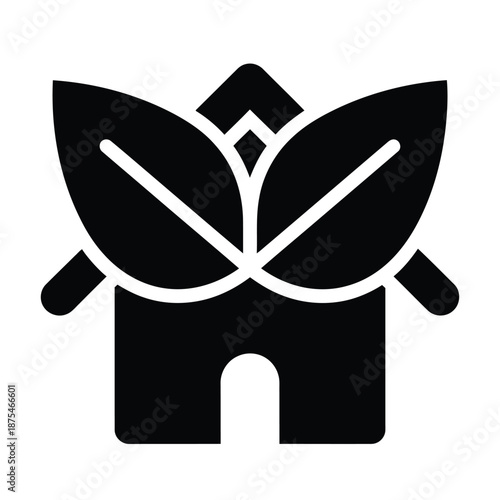 House silhouette with large leaves for eco friendly home and sustainable living