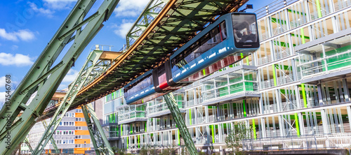 Wallpaper Mural Panorama of the historic Schwebebahn train in front of a modern building in Wuppertal, Germany Torontodigital.ca