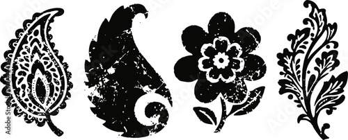 Set of four vintage floral and paisley decorative black ink stamps isolated on white background
