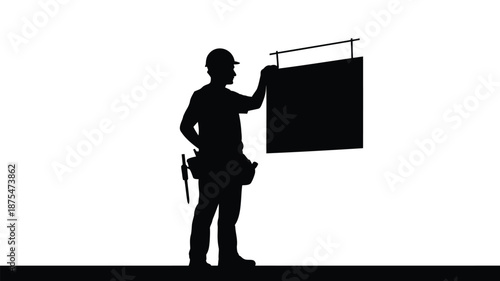 Construction worker presenting sign on white background