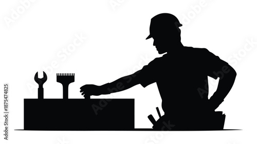 Mechanic reaching for tool in box with wrench and brush