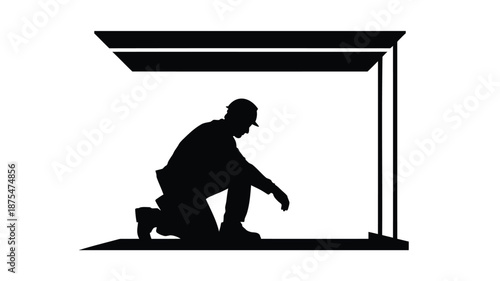 Construction worker installing flooring in modern building