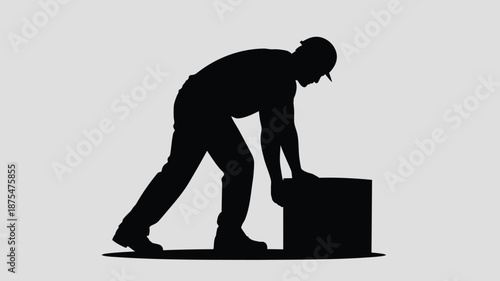Man lifting heavy box in silhouette