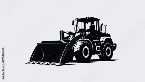 Silhouette of a black wheel loader tractor