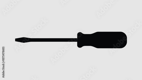 Flathead screwdriver silhouette on gray background
