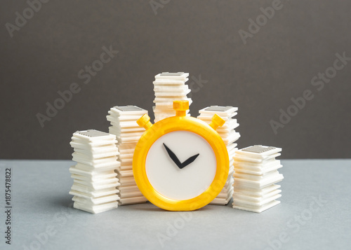 Obraz na plátně Stacks of papers and a stopwatch