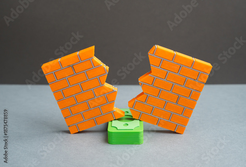 фотографія A stack of money breaks down a wall