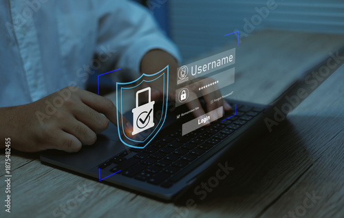 Fotografie User accessing secure login system on laptop with digital shield and password interface