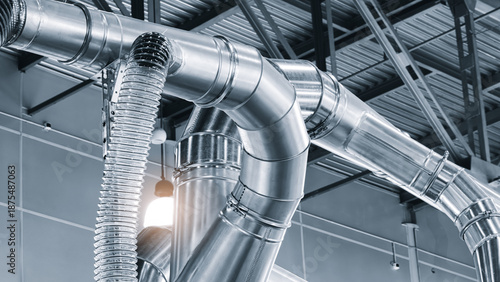 Φωτογραφία Air ducts in a factory for removing sawdust and dust during the production of furniture or other products, viewed from the bottom up