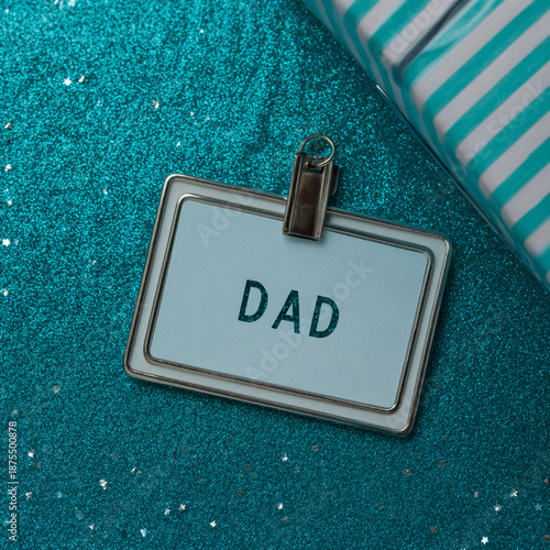 Personalized dad badge on sparkling background