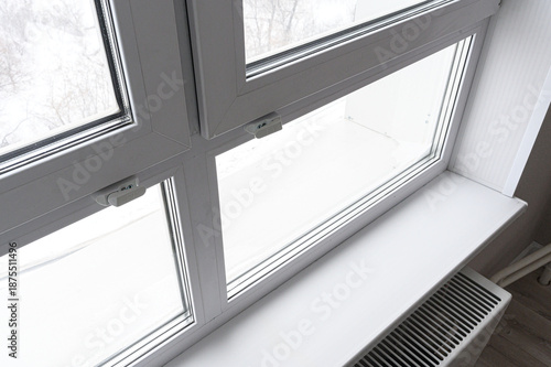 Quadro em tela white PVC window with multiple panes and a white windowsill