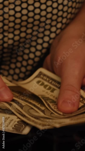 Vertical video. Female hands counting US dollar bills. Money cash