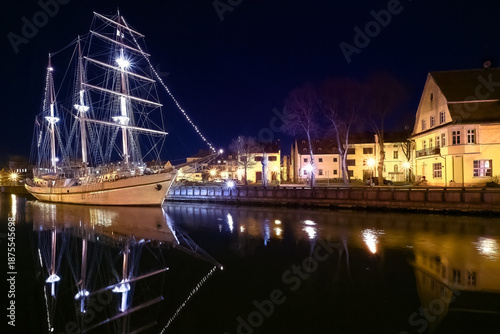 Sailing boat anchored orr moored in old town of Klaipeda, Lithuania