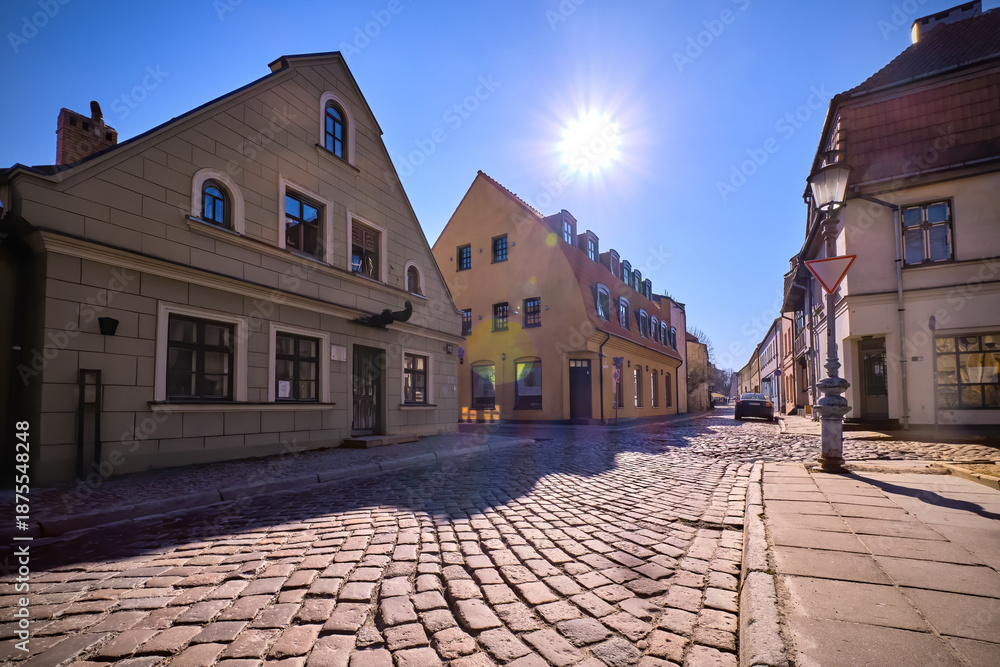 Fototapeta premium Cobbled pavements of old town streets in Klaipeda, Lithuania on sunny