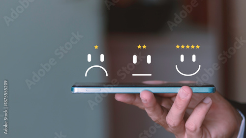 satisfaction, online reviews, service quality, user feedback. Customer experience concept with five star rating and smile icon floating above a smartphone.