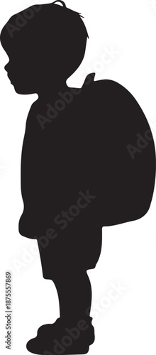 Silhouette of a child carrying a backpack standing sideways