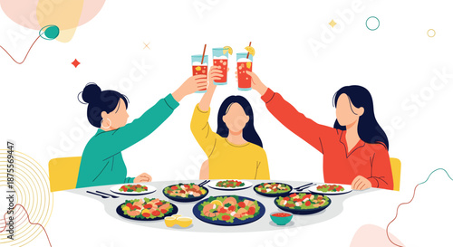 Three young women are sitting at a dinner table toasting with drinks and celebrating their friendship during a party.