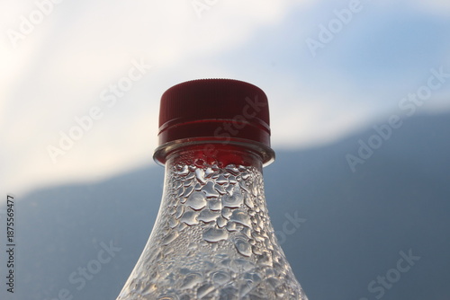 Clear Bottle Neck with Red Lid in Soft Daylight