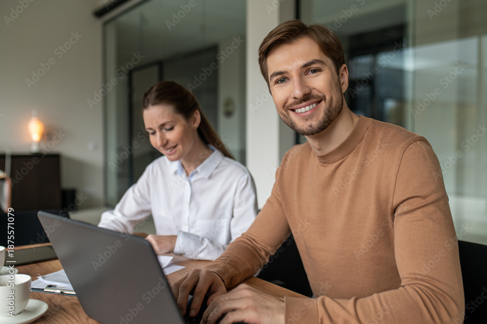 Fototapeta premium Two people working together on the project and looking excited