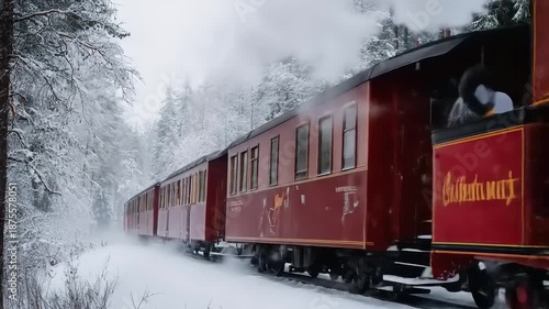 Vintage steam train glides through snowy forest landscape winter scene