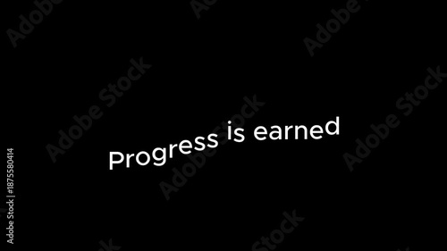 The motivational phrase 'Progress is earned' written on a black background.